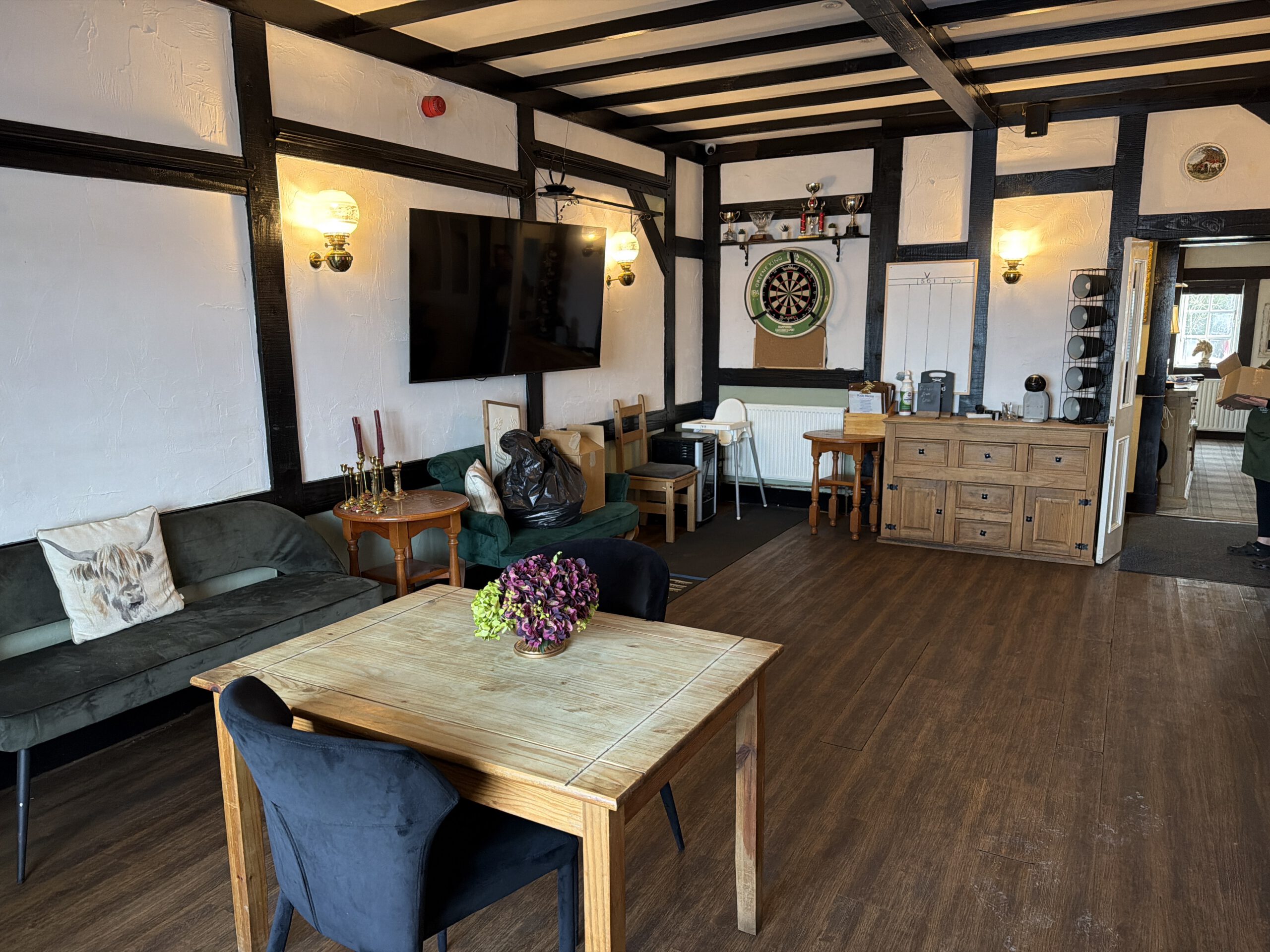 Cosy pub lounge with dartboard at The Horse and Jockey Bentley