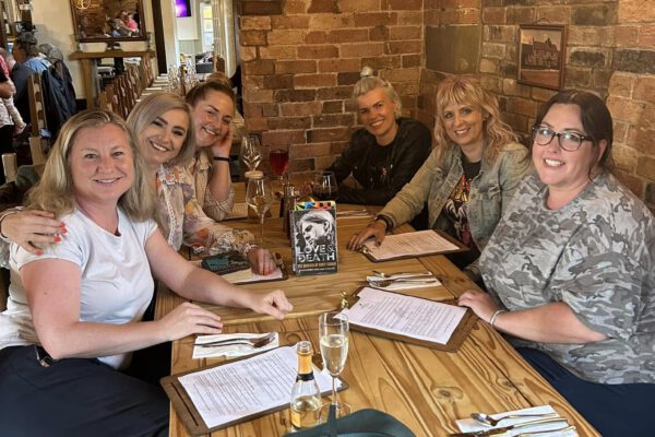 Group dining around a table at The Horse and Jockey Bentley