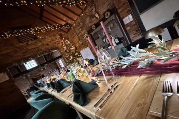 Barn restaurant table setting with candles at The Horse and Jockey Bentley