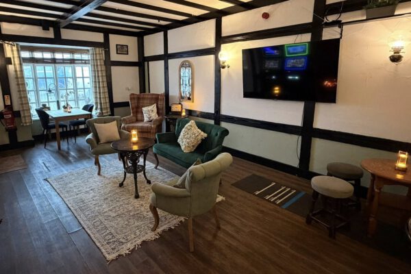 Cosy fireside lounge seating at The Horse and Jockey Bentley