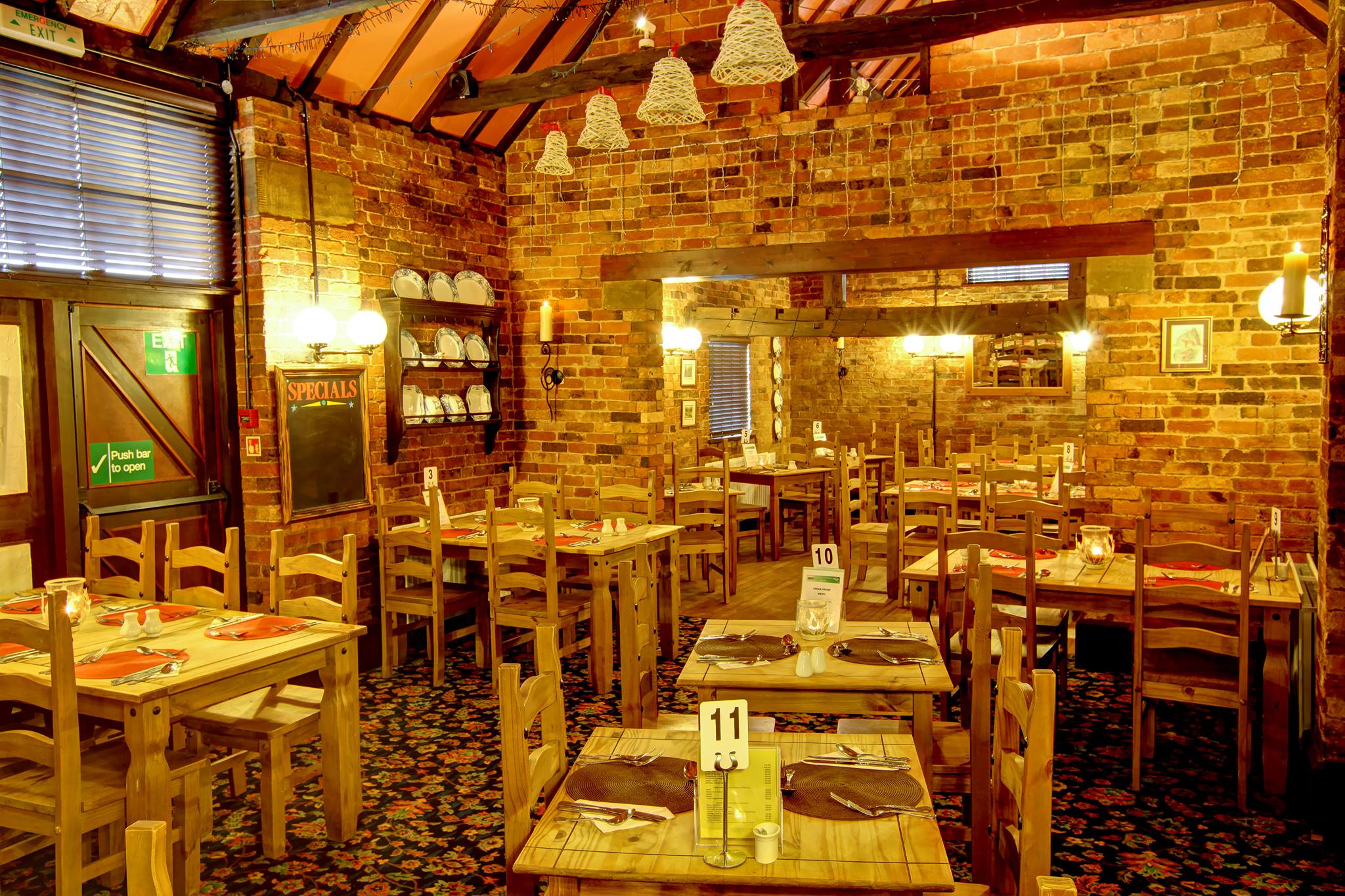 Traditional dining room with wooden tables at The Horse and Jockey Bentley near Atherstone